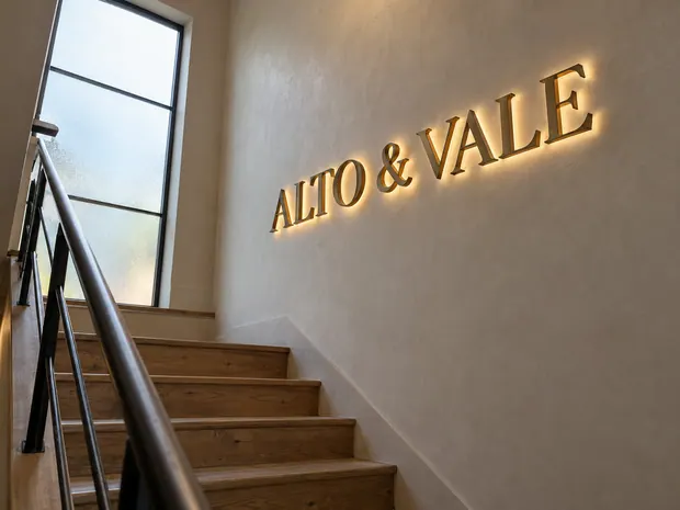 Illustrative custom metal sign concept: Warm Stairwell with Illuminated Signage