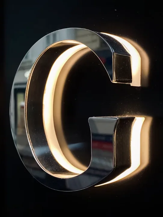 Close-up photograph of dimensional metal sign lettering